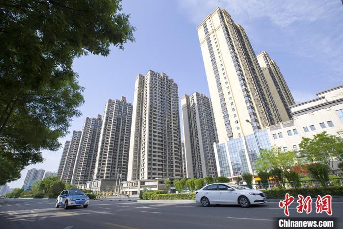 資料圖：車輛從一樓盤前經(jīng)過(guò)。 <a target='_blank' href='/'><p  align=